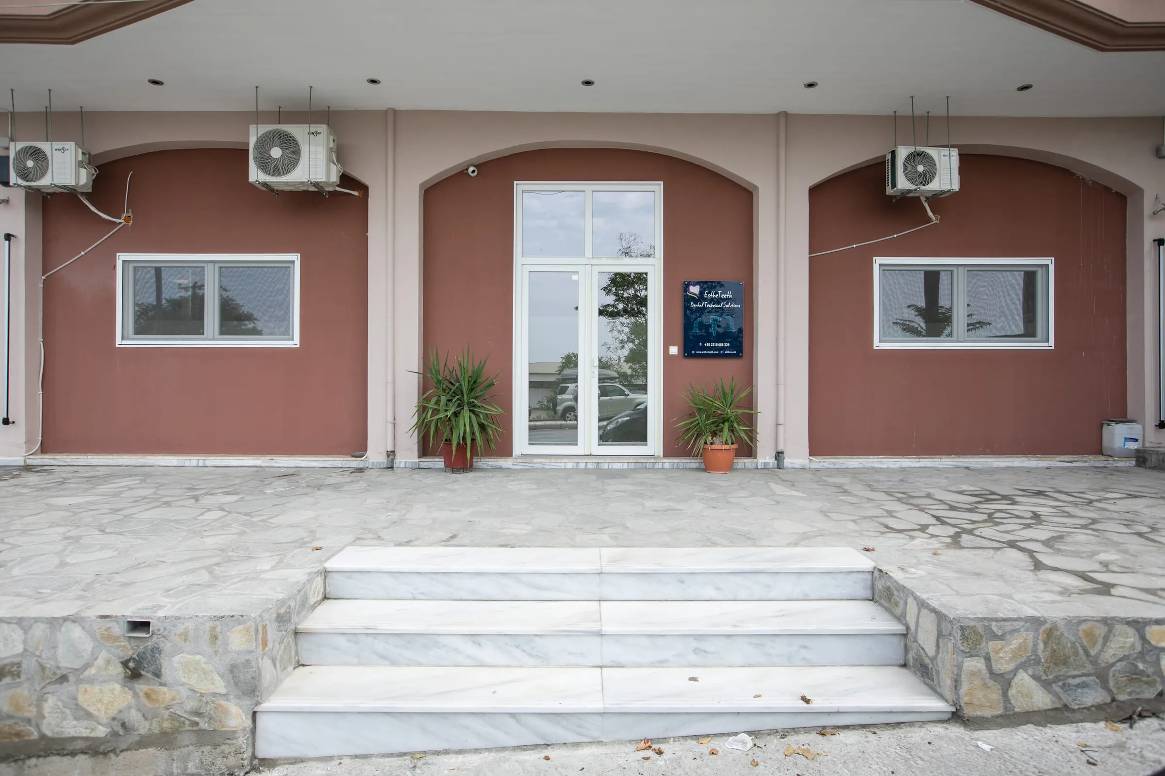 The entrance to the EstheTeeth lab at Agiou Dimitriou 28